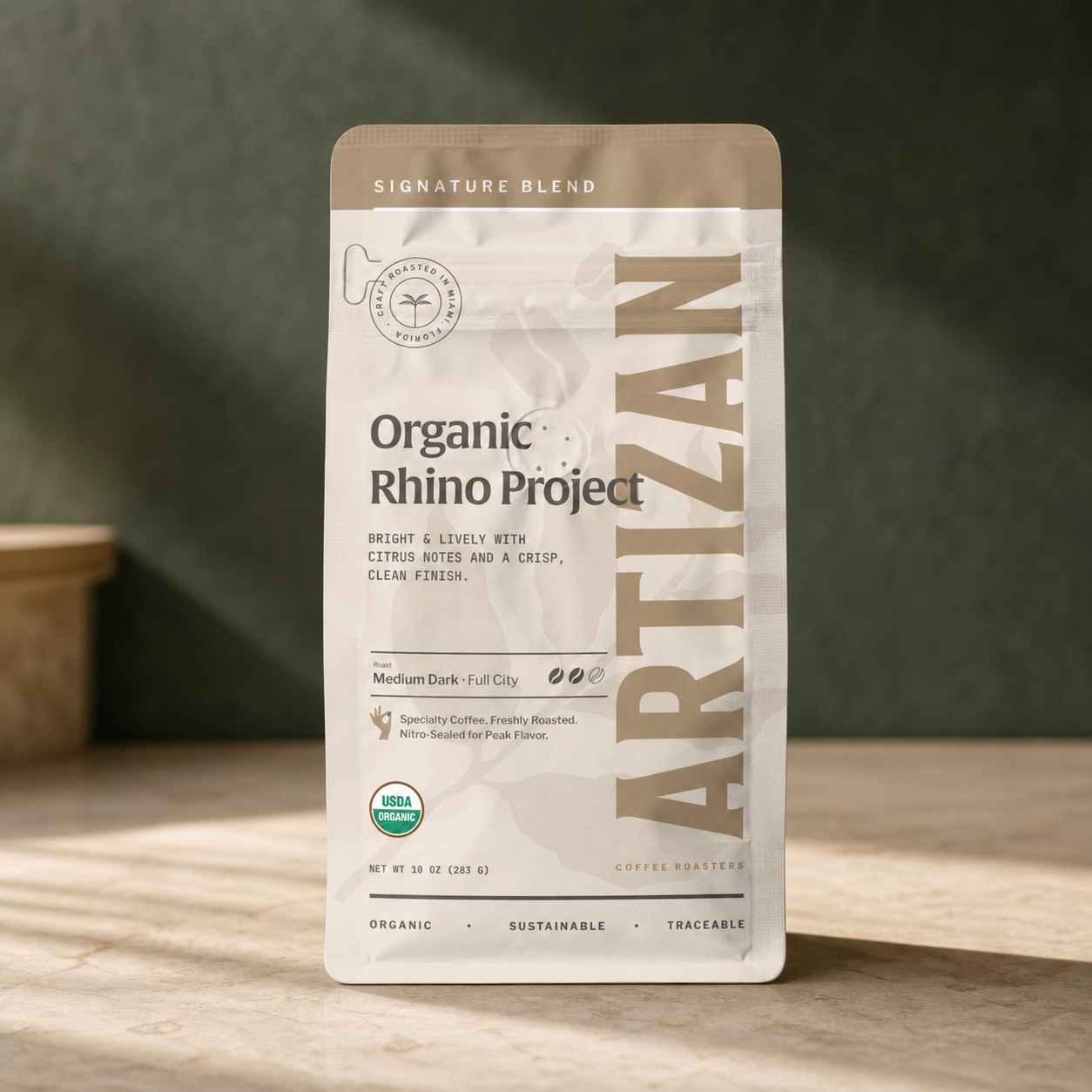 Artizan Coffee Roasters Organic Rhino Project coffee bag in premium product photography
